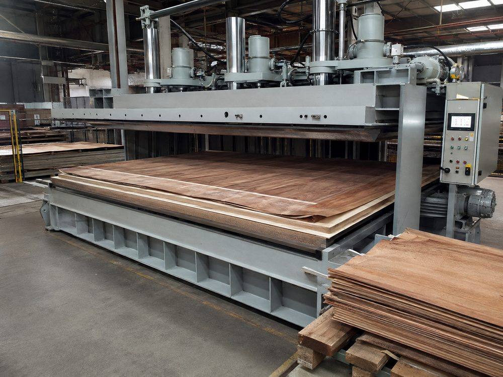 Hot press for wood veneer lamination